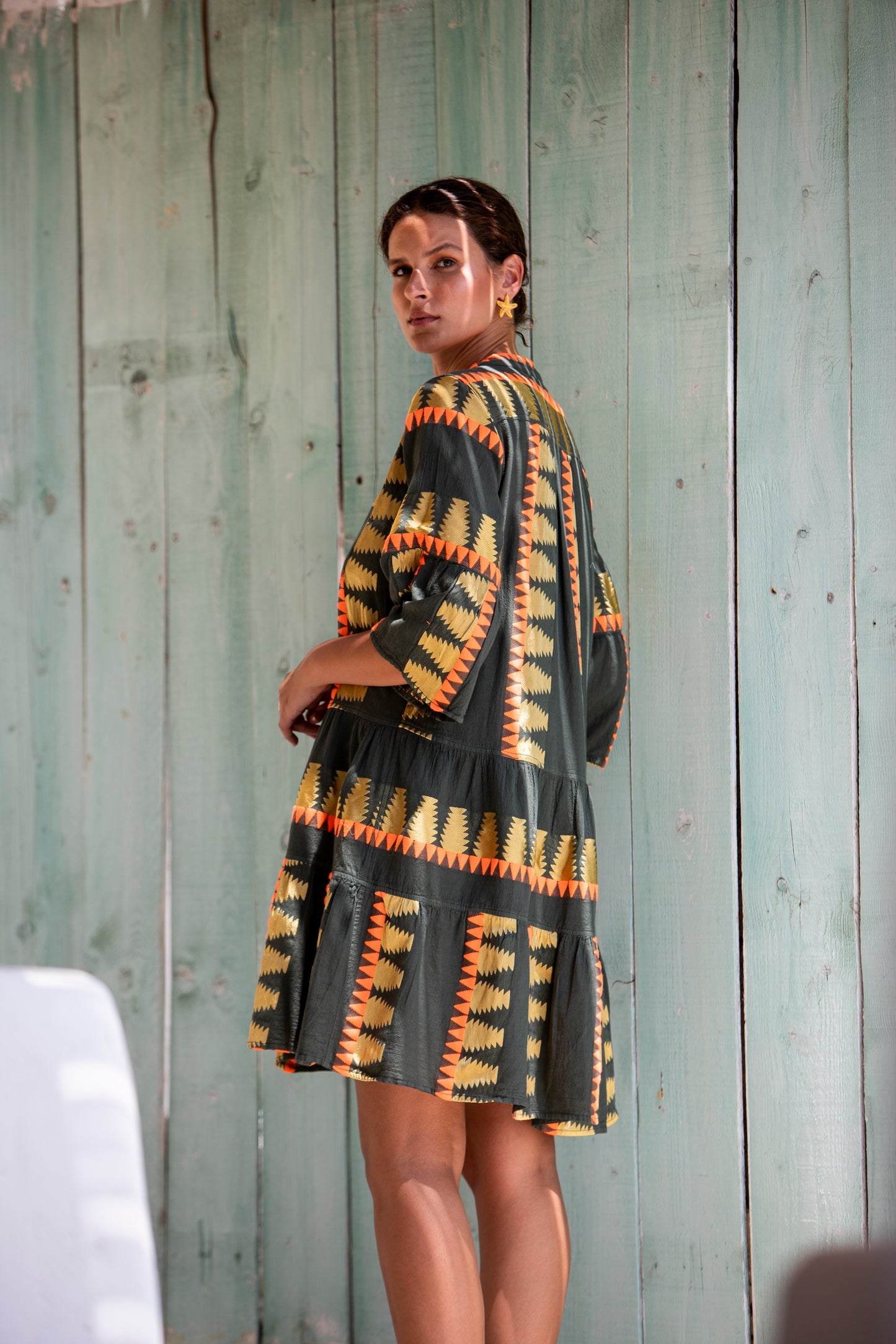 Side facing **PRE-ORDER 1st APRIL** Nema Zadie Embroidered Aztec Khaki Dress. The perfect addition to your luxury designer resort wear wardrobe. Made in Greece.