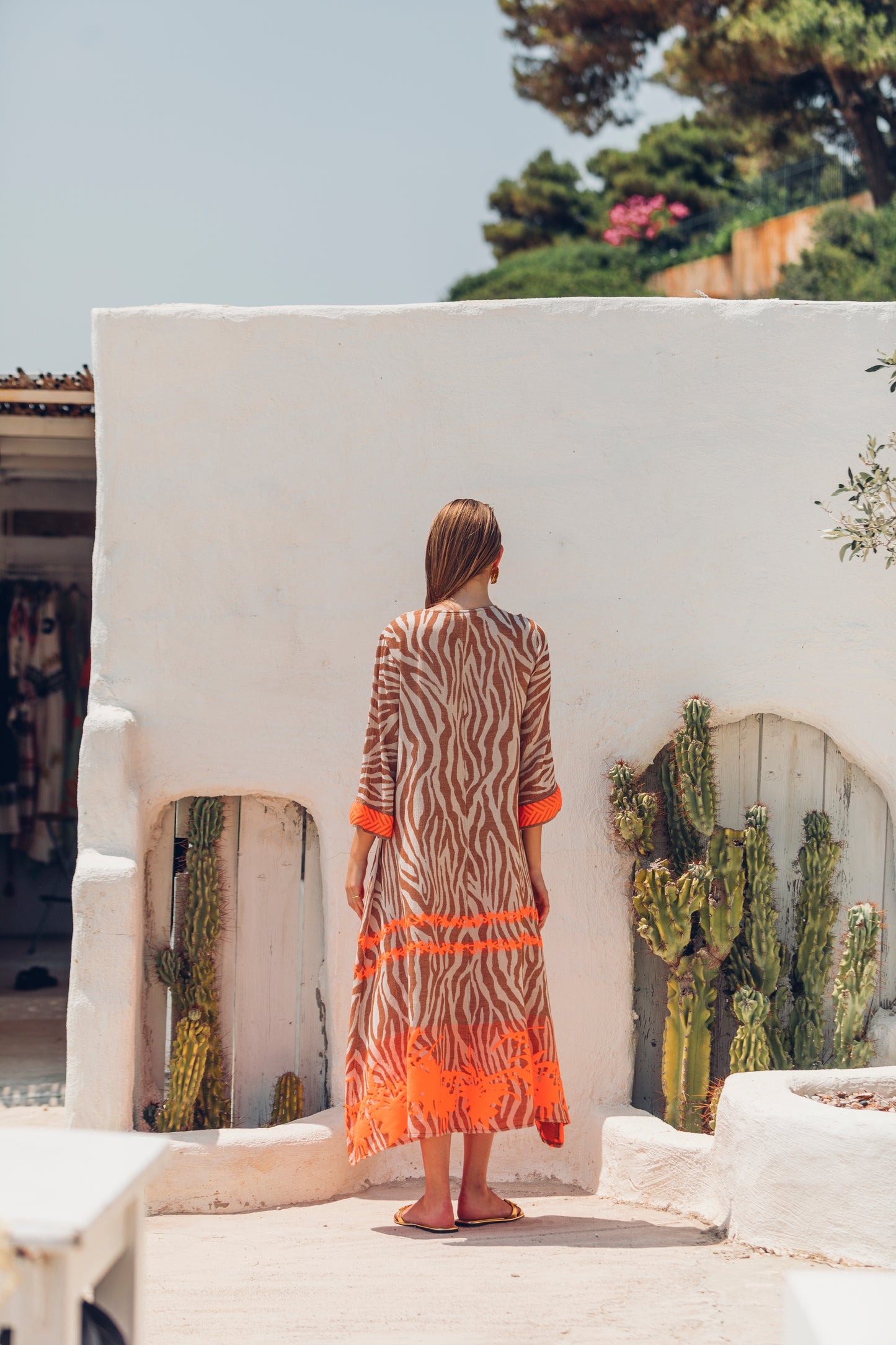 Back facing **PRE-ORDER 1st APRIL** Nema Mera Zebra Print Embroidered Maxi Dress. The perfect addition to your luxury designer resort wear wardrobe.