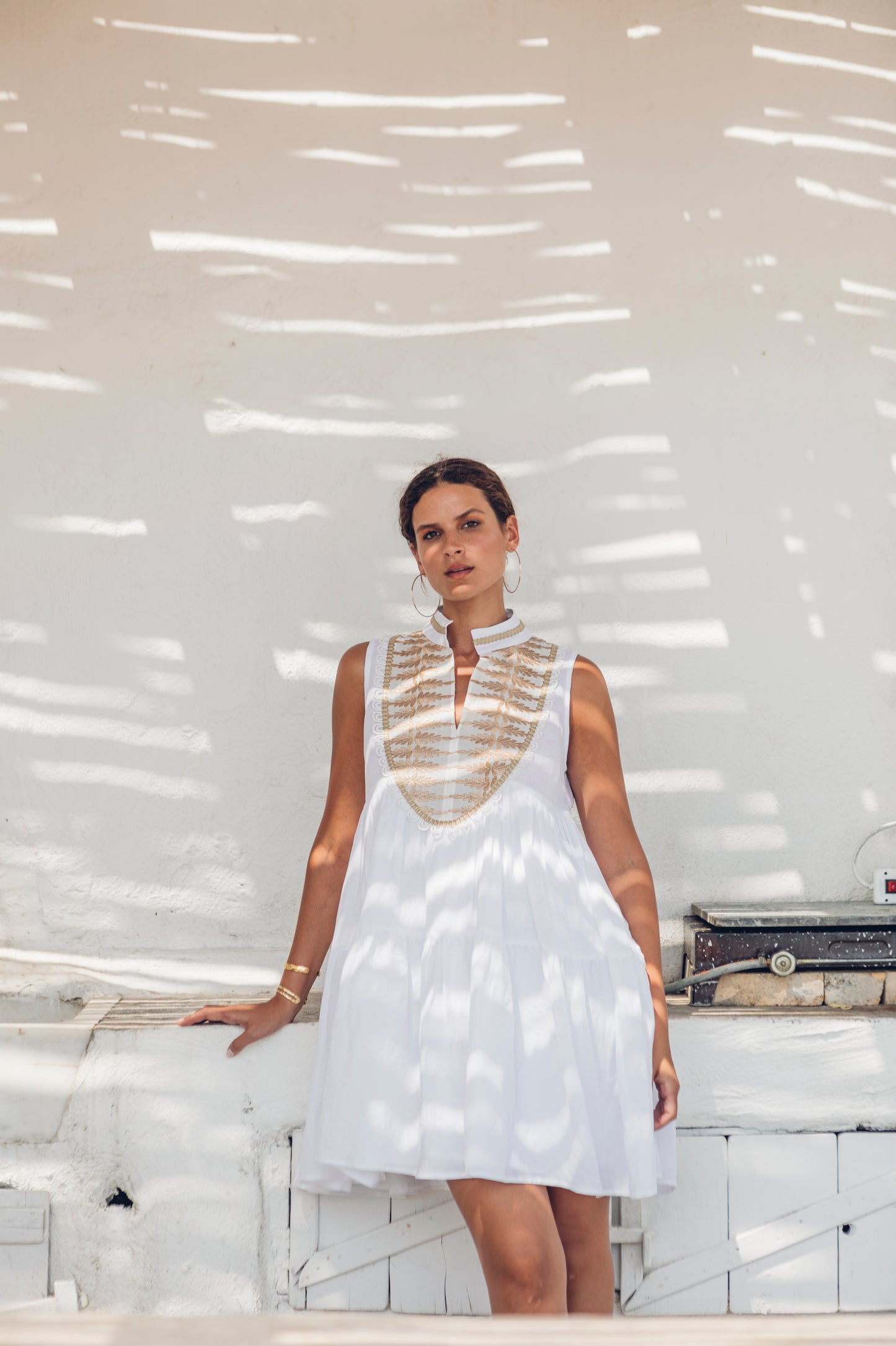 Close up **PRE-ORDER 1st APRIL** Nema Dafne White Sleeveless Dress With Gold Embroidery. The perfection addition to your luxury designer resort wear wardrobe.