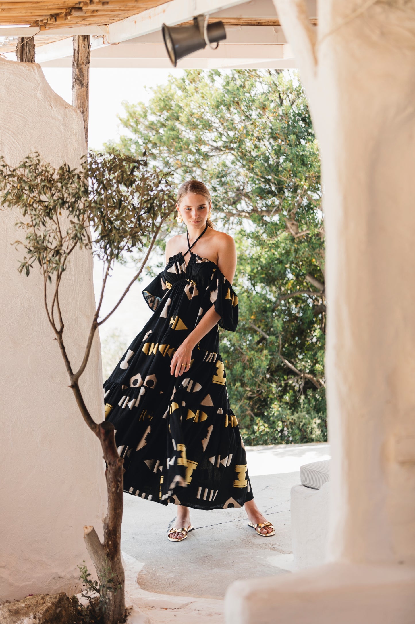side facing **PRE-ORDER 1st APRIL** Nema Sadie Embroidered Black Geometric Dress. The perfect addition to your luxury designer resort wear wardrobe.