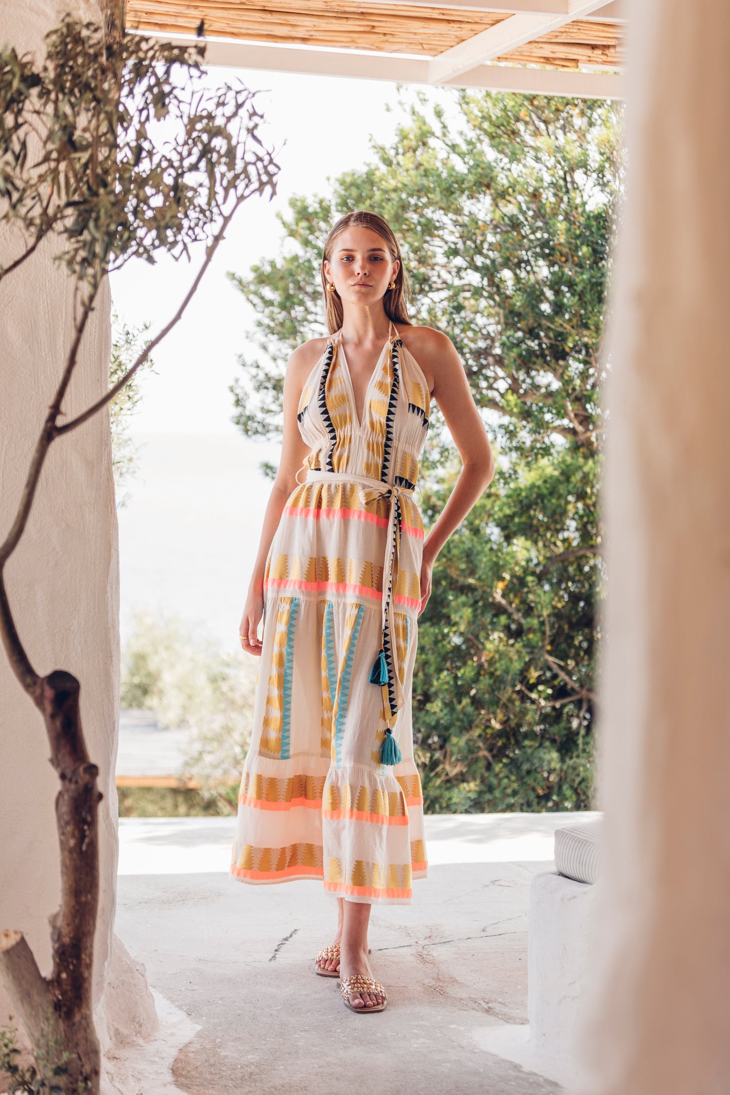Front facing 3 **PRE-ORDER 1st APRIL** Nema Karen Embroidered Backless Halter Neck Dress. The perfect addition to your luxury designer resort wear wardrobe.