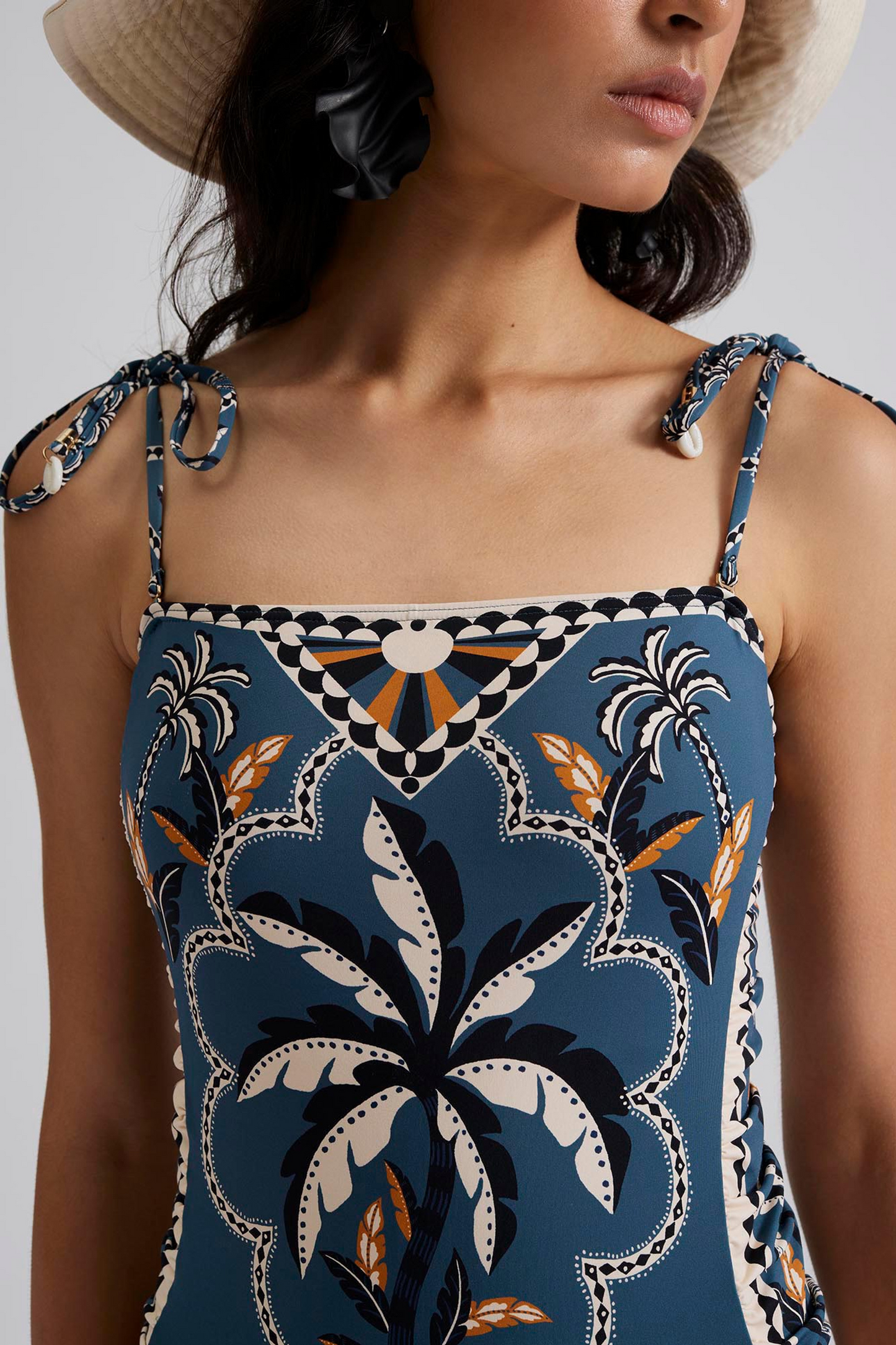Front close up Malina Printed swimsuit with fern tie shoulder. The perfection addition to your luxury designer resort wear wardrobe.