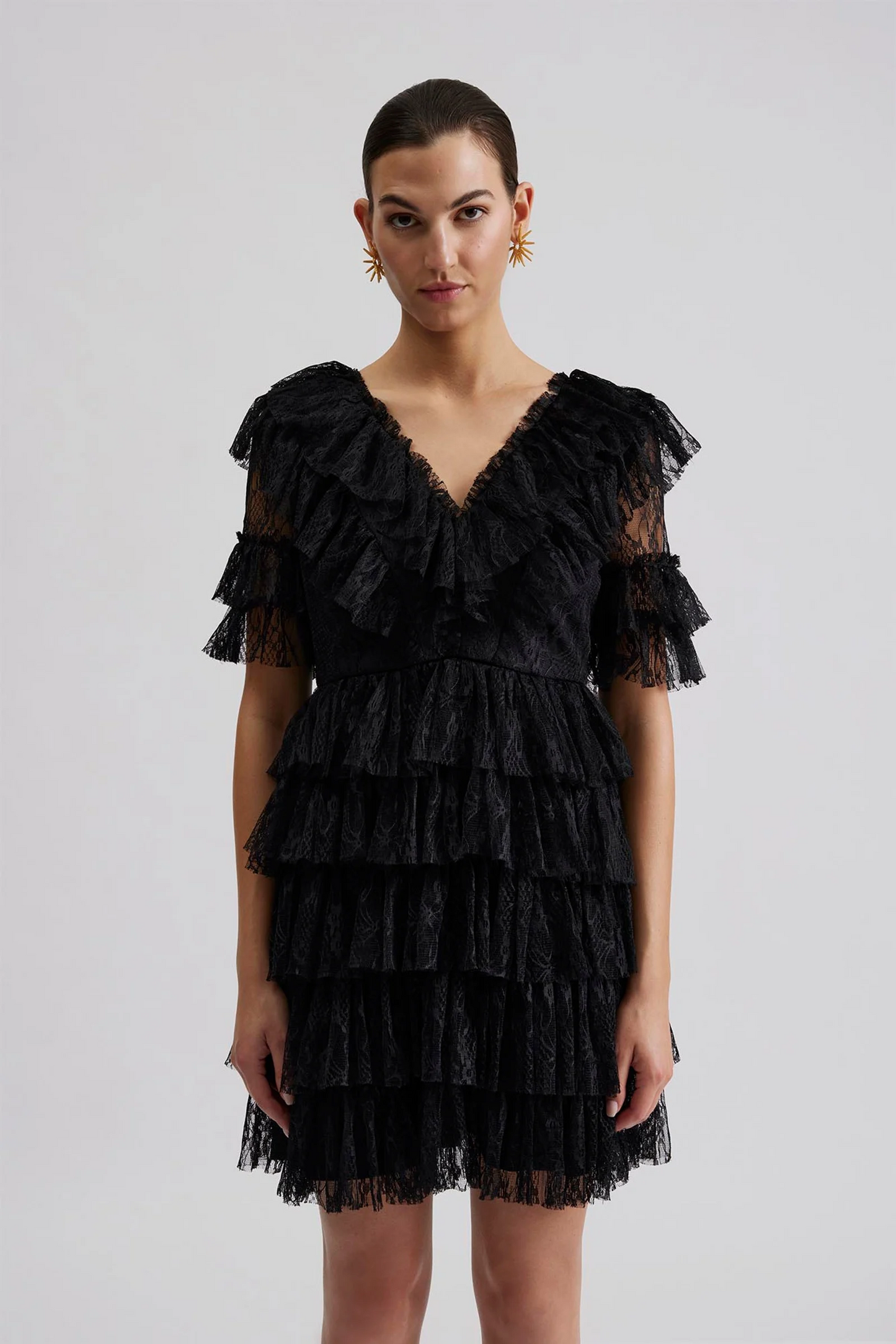 Front facing 2 Malina Ready-to-Wear short sleeved lace dress with frill details and v-neck. The perfect addition to your luxury designer resort wear wardrobe.