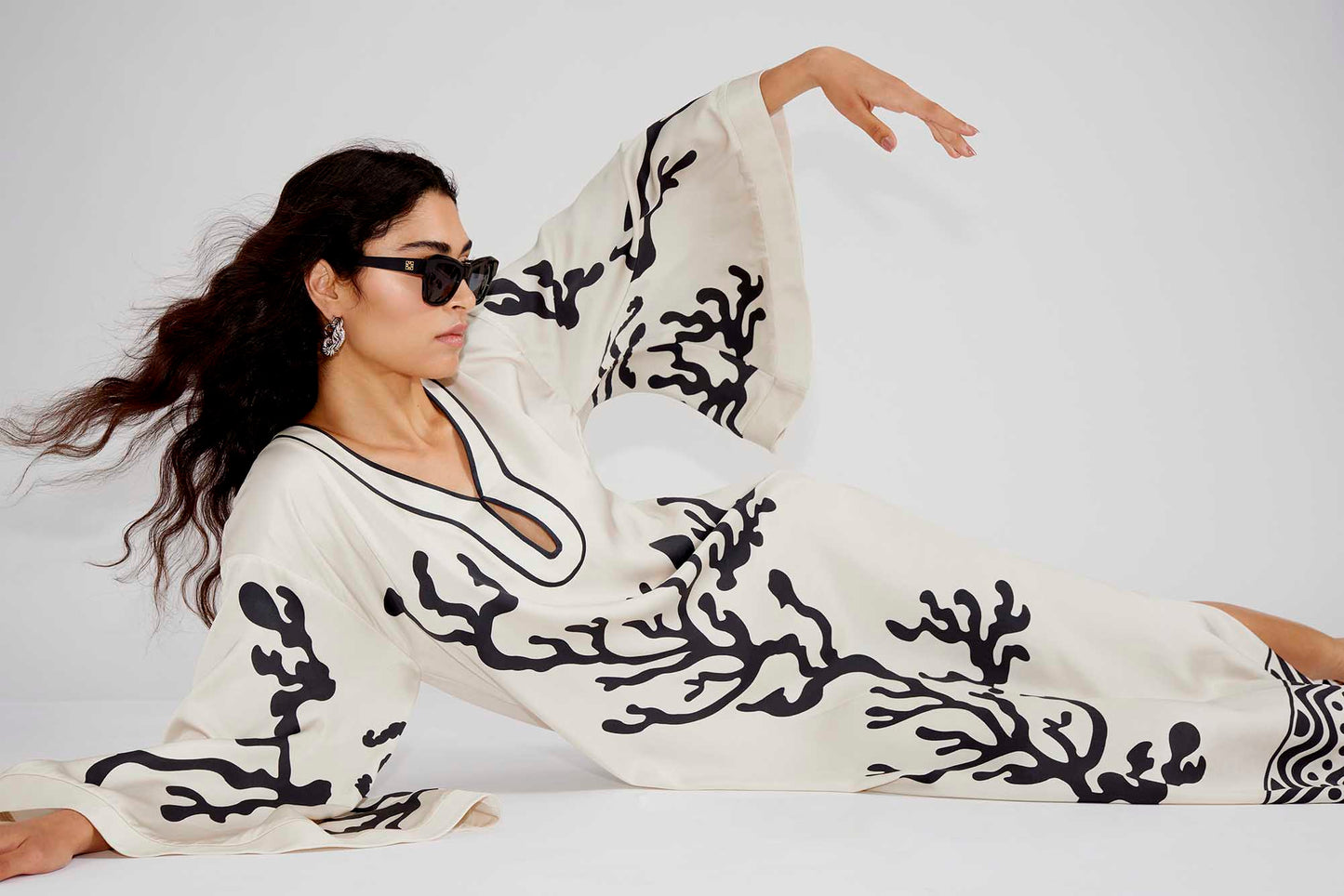 Side on Malina Printed satin kaftan dress with wide sleeve and cut-out details. The perfect addition to your luxury designer resort wear wardrobe.
