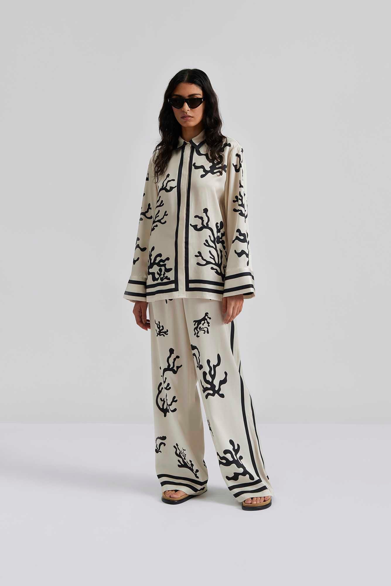 front facing Malina Printed shirt in a wide fit with long sleeves and hidden button closure. The perfect addition to your luxury designer resort wear wardrobe.
