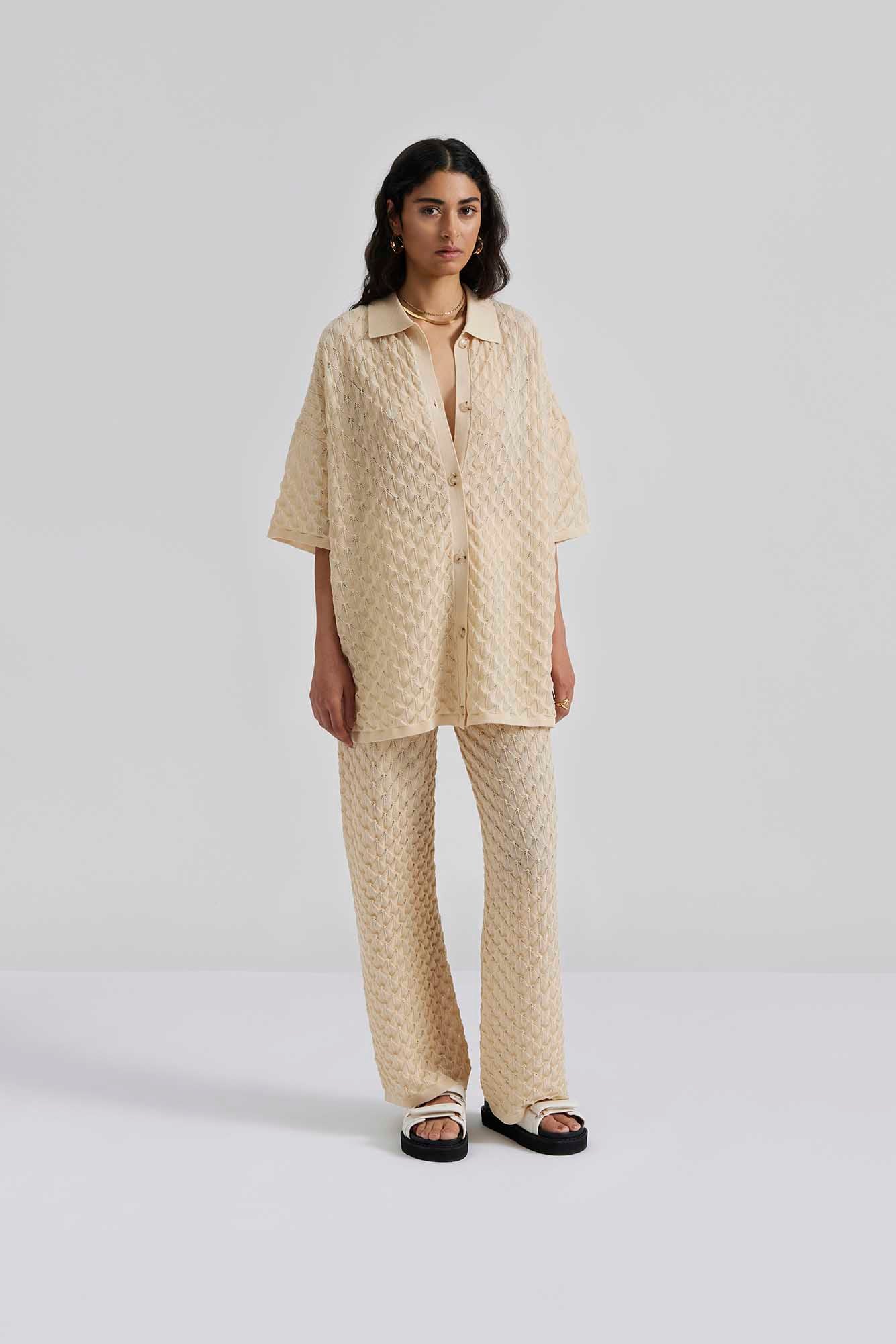 Front facing Malina Short sleeve crocheted shirt with buttons in the front. The perfect addition to your luxury designer resort wear wardrobe.
