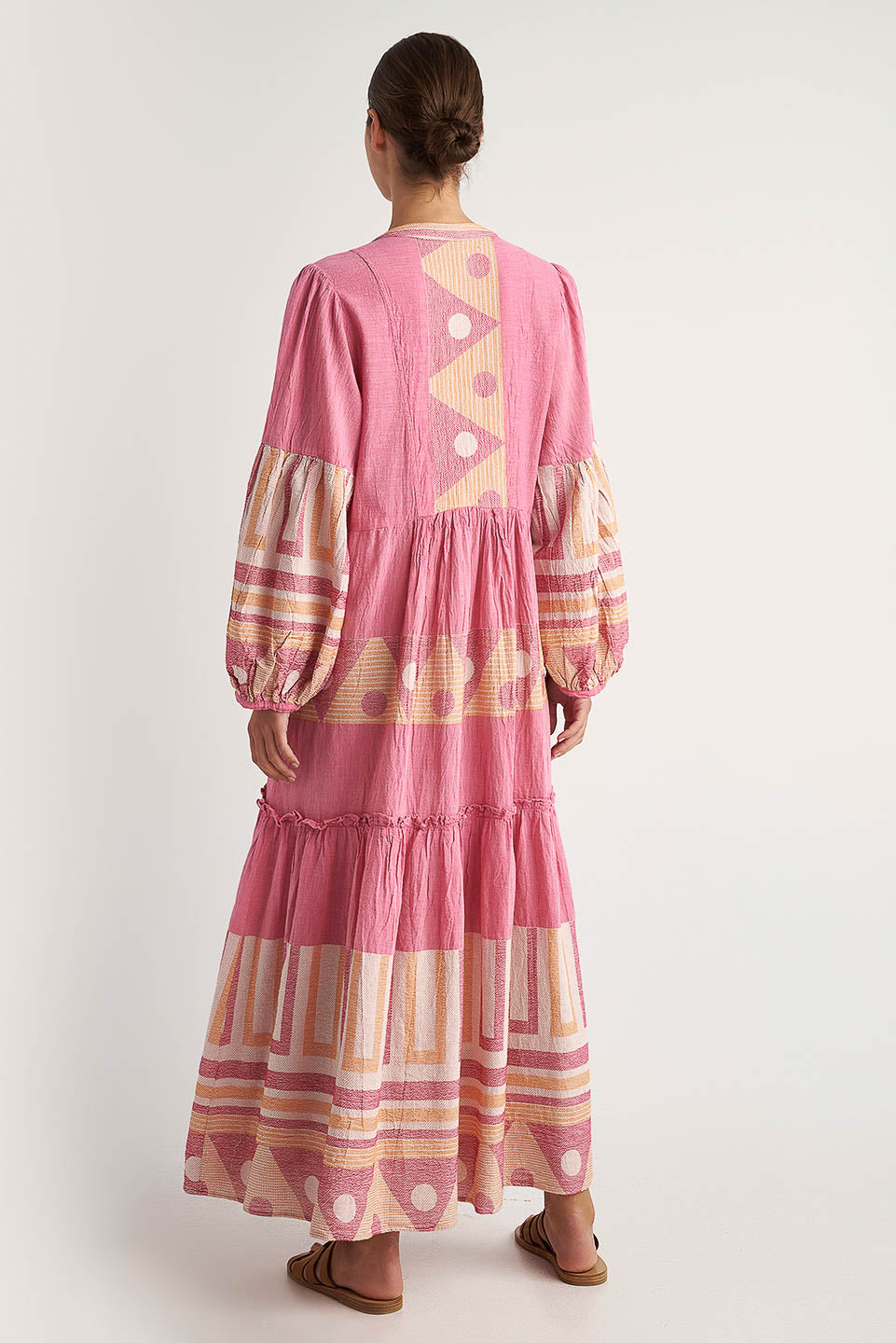 Back facing Pearl & Caviar long sleeve pink maxi dress with gathered cuffs and side pockets. The perfect addition to your luxury designer resort wear wardrobe.