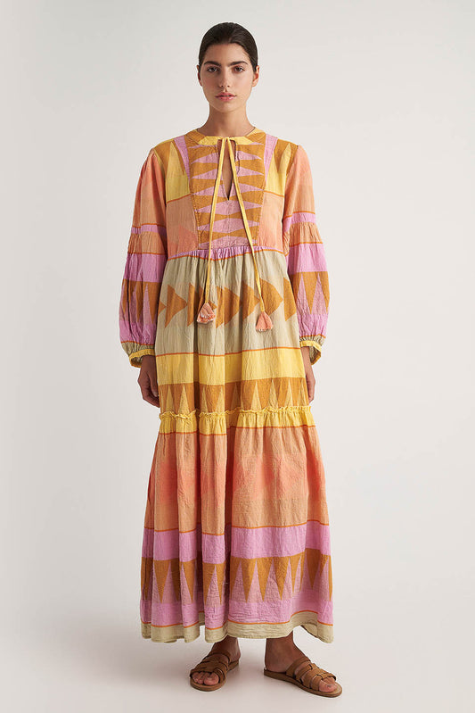 Front facing Pearl & Caviar Long sleeve pastel maxi dress with side pockets and Neck tie.The perfection addition to your luxury designer resort wear wardrobe.