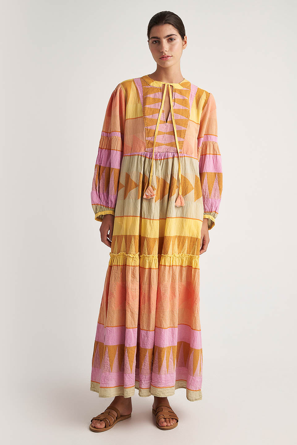 Front facing 2 Pearl & Caviar Long sleeve pastel maxi dress with side pockets and Neck tie.The perfection addition to your luxury designer resort wear wardrobe.