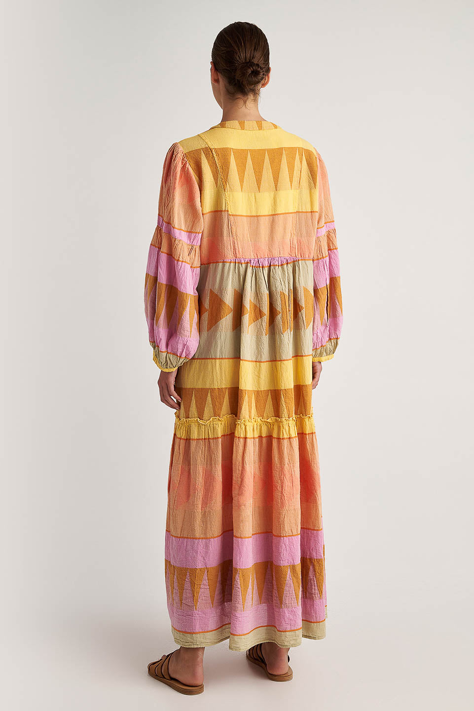 Back facing Pearl & Caviar Long sleeve pastel maxi dress with side pockets and Neck tie.The perfection addition to your luxury designer resort wear wardrobe.