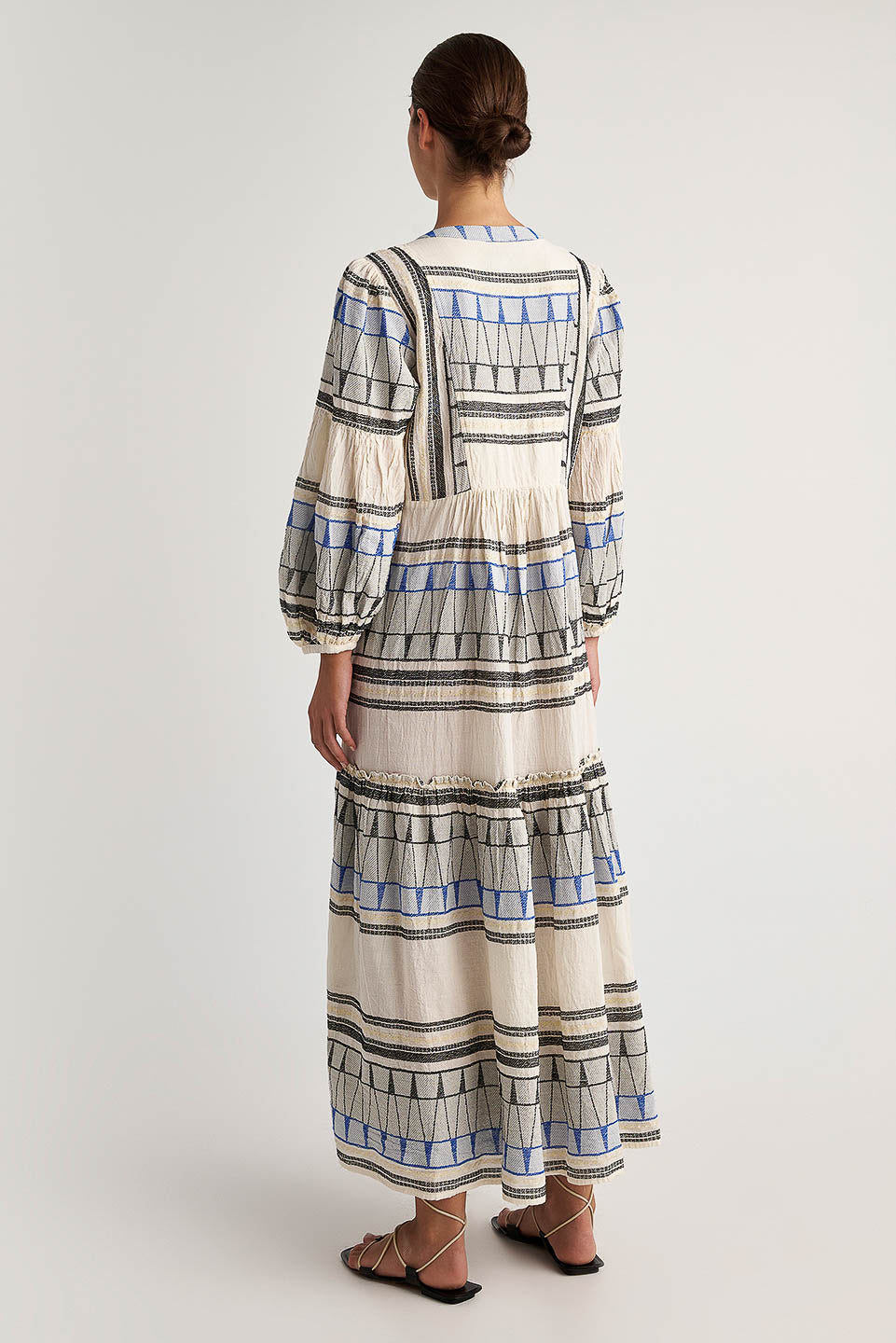 Back facing Pearl & Caviar Long sleeve maxi dress with embroidered detailing. The perfection addition to your luxury designer resort wear wardrobe.