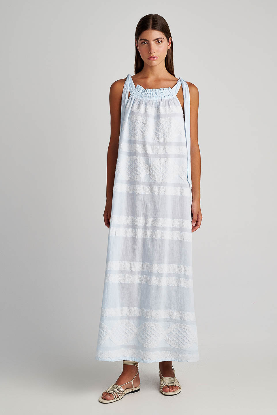 Front facing Pearl & Caviar Tie shoulder strap baby blue maxi dress with textured fabric.The perfection addition to your luxury designer resort wear wardrobe.