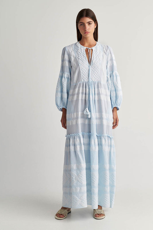 Front acing Pearl & Caviar Long sleeve baby blue maxi dress with textured pattern. The perfection addition to your luxury designer resort wear wardrobe.