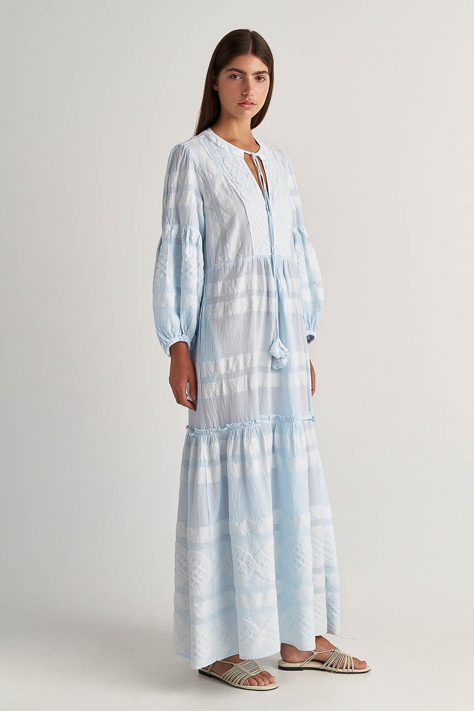Front facing 2 Pearl & Caviar Long sleeve baby blue maxi dress with textured pattern. The perfection addition to your luxury designer resort wear wardrobe.