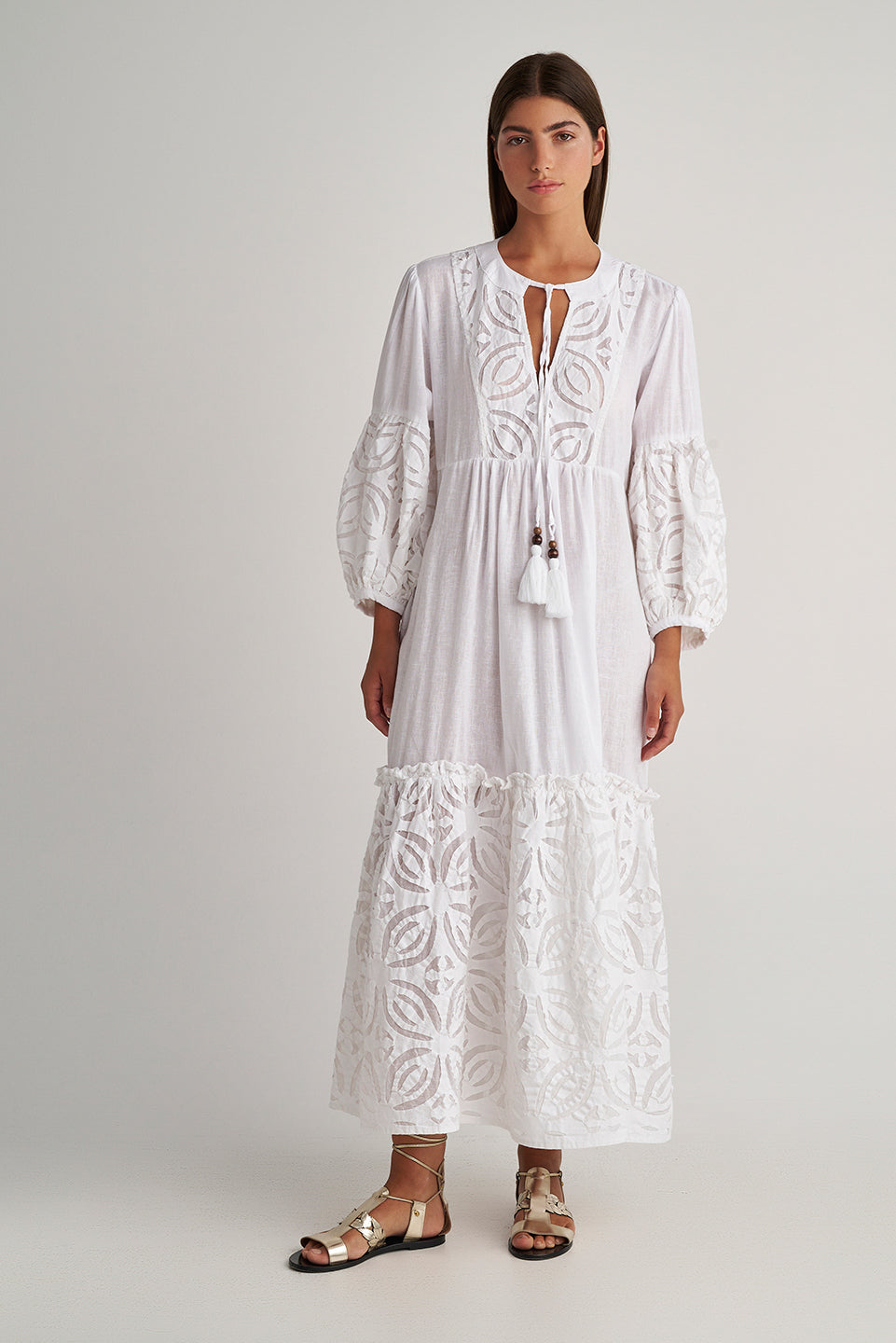 Front facing 2 Pearl & Caviar Long sleeve pure white maxi dress with layered cut-out detailing. The perfect addition to your luxury designer resort wear wardrobe.