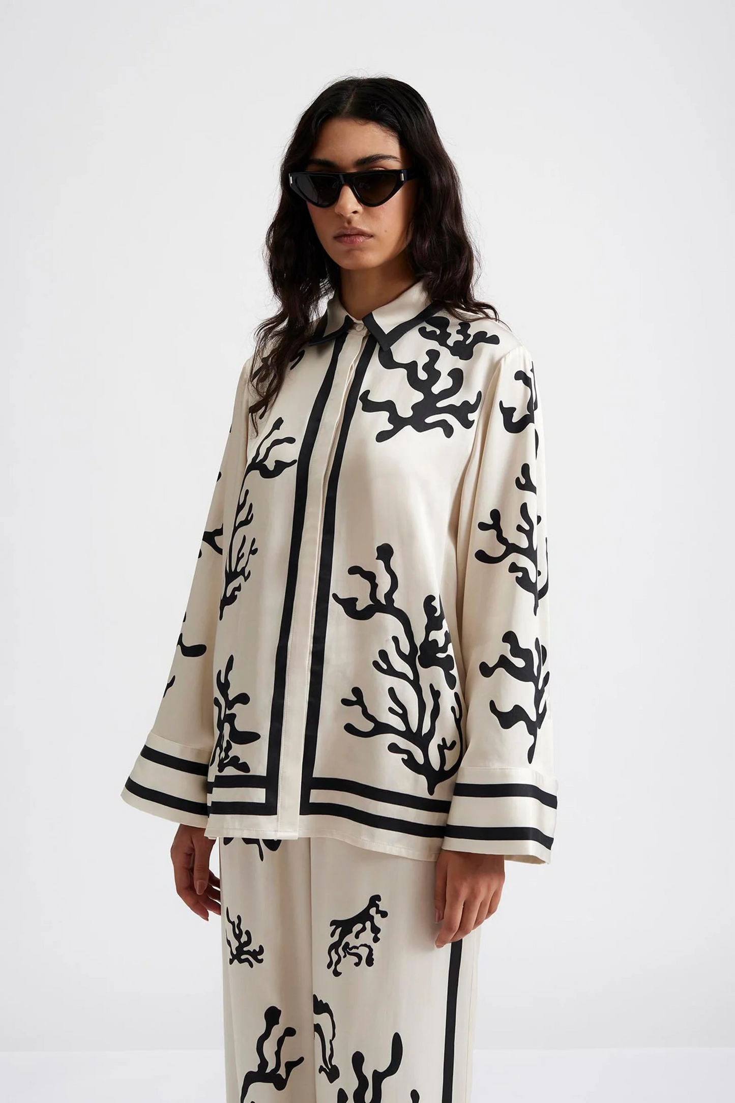 Front facing 2 Malina Printed shirt in a wide fit with long sleeves and hidden button closure. The perfect addition to your luxury designer resort wear wardrobe.