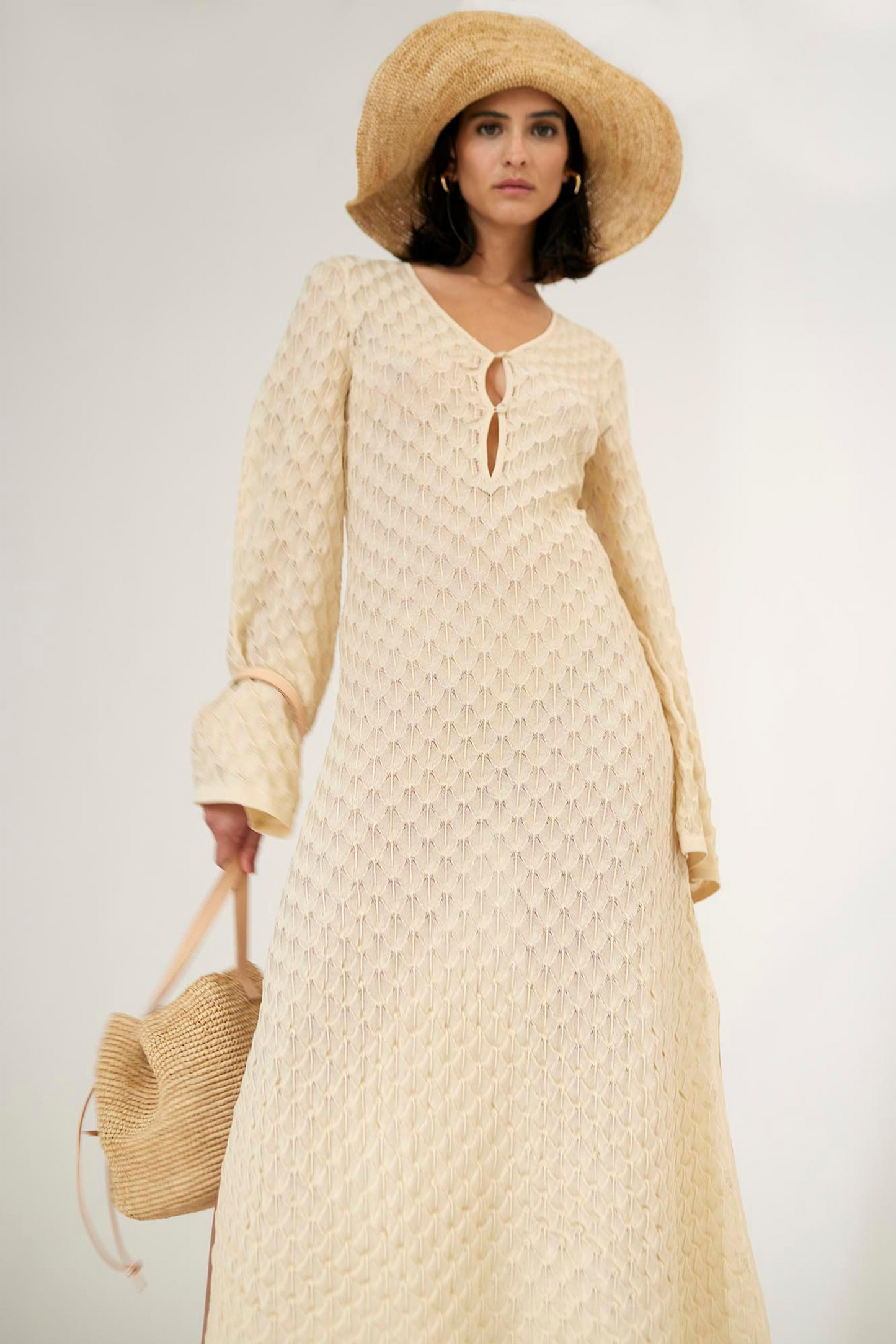 Front facing 2 Malina Knitted kaftan in maxi length with wide sleeves and cut-out neckline details. The perfect addition to your luxury designer resort wear wardrobe.