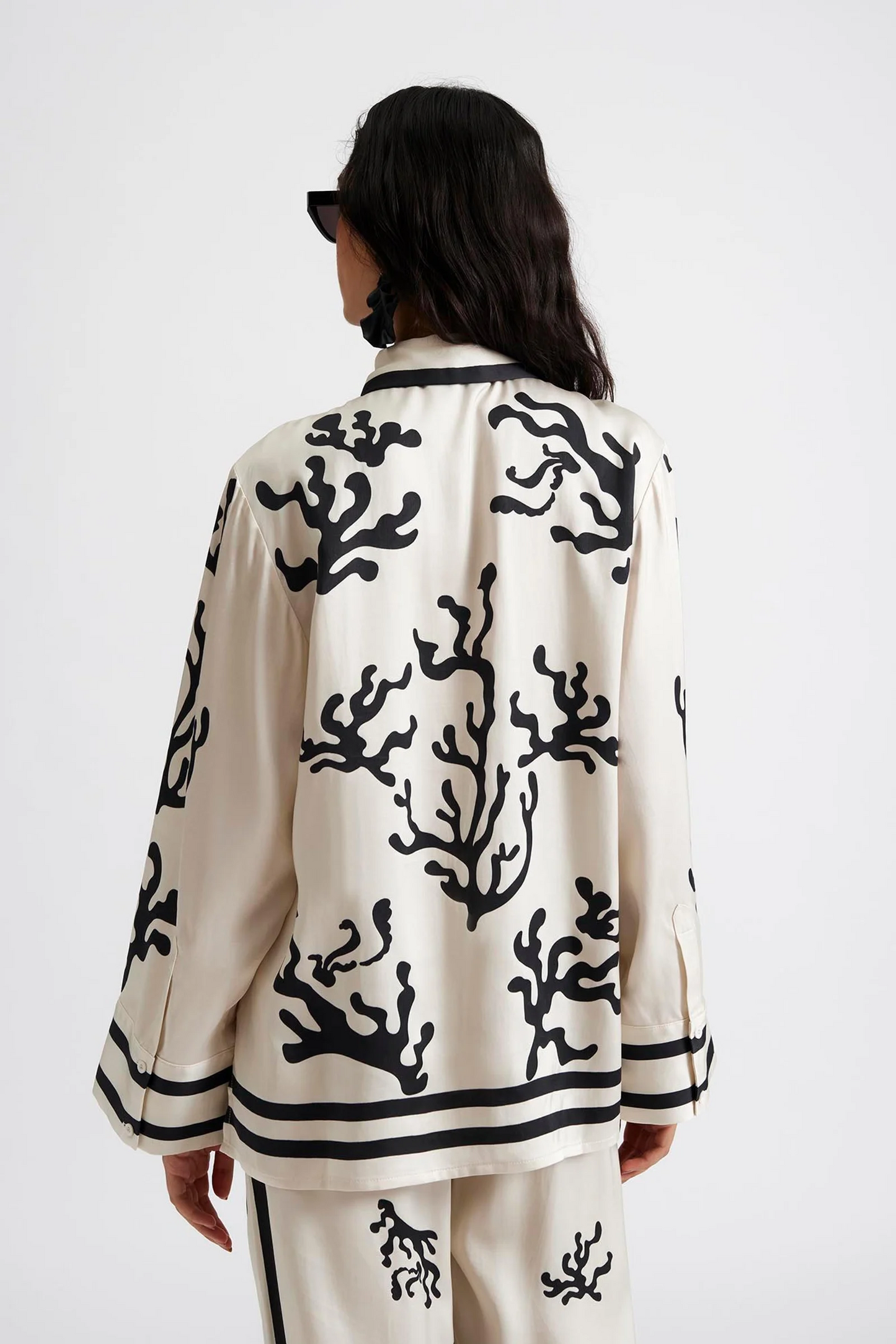 Back facing Malina Printed shirt in a wide fit with long sleeves and hidden button closure. The perfect addition to your luxury designer resort wear wardrobe.