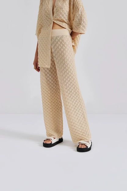 Close up Malina designer high waisted wide knit crocheted pants with elasticated waist. Perfect for your next luxury trip to paradise.