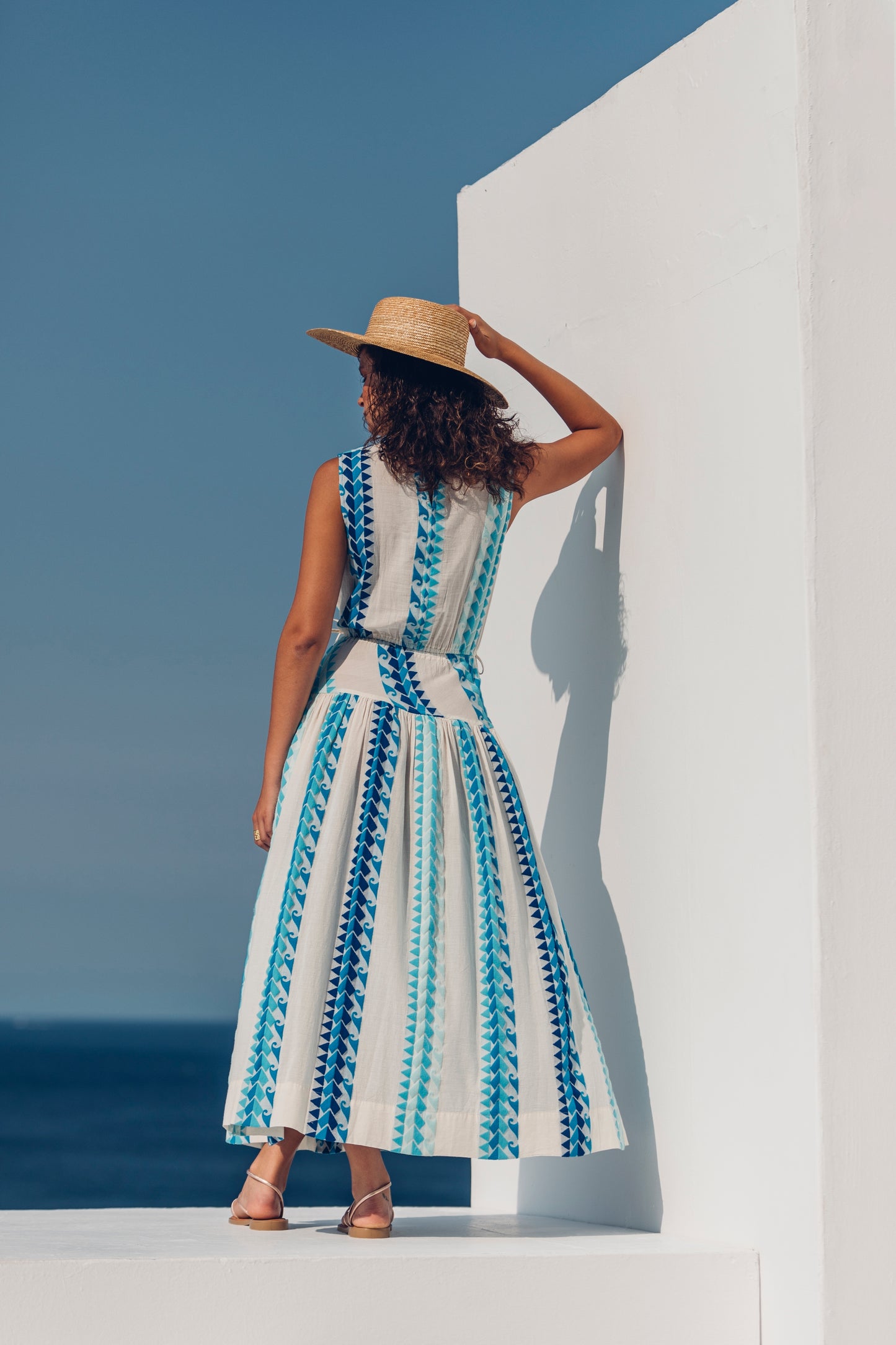 Back facing Nema Neira Jacquard Blue Maxi Dress. The perfect addition to your luxury designer resort wear wardrobe.  