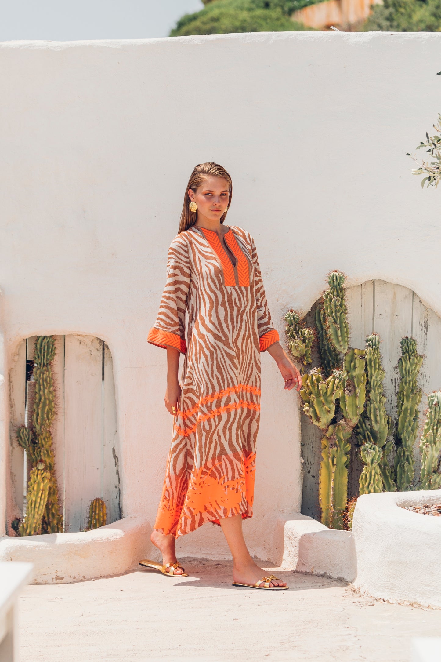 Side facing **PRE-ORDER 1st APRIL** Nema Mera Zebra Print Embroidered Maxi Dress. The perfect addition to your luxury designer resort wear wardrobe.  