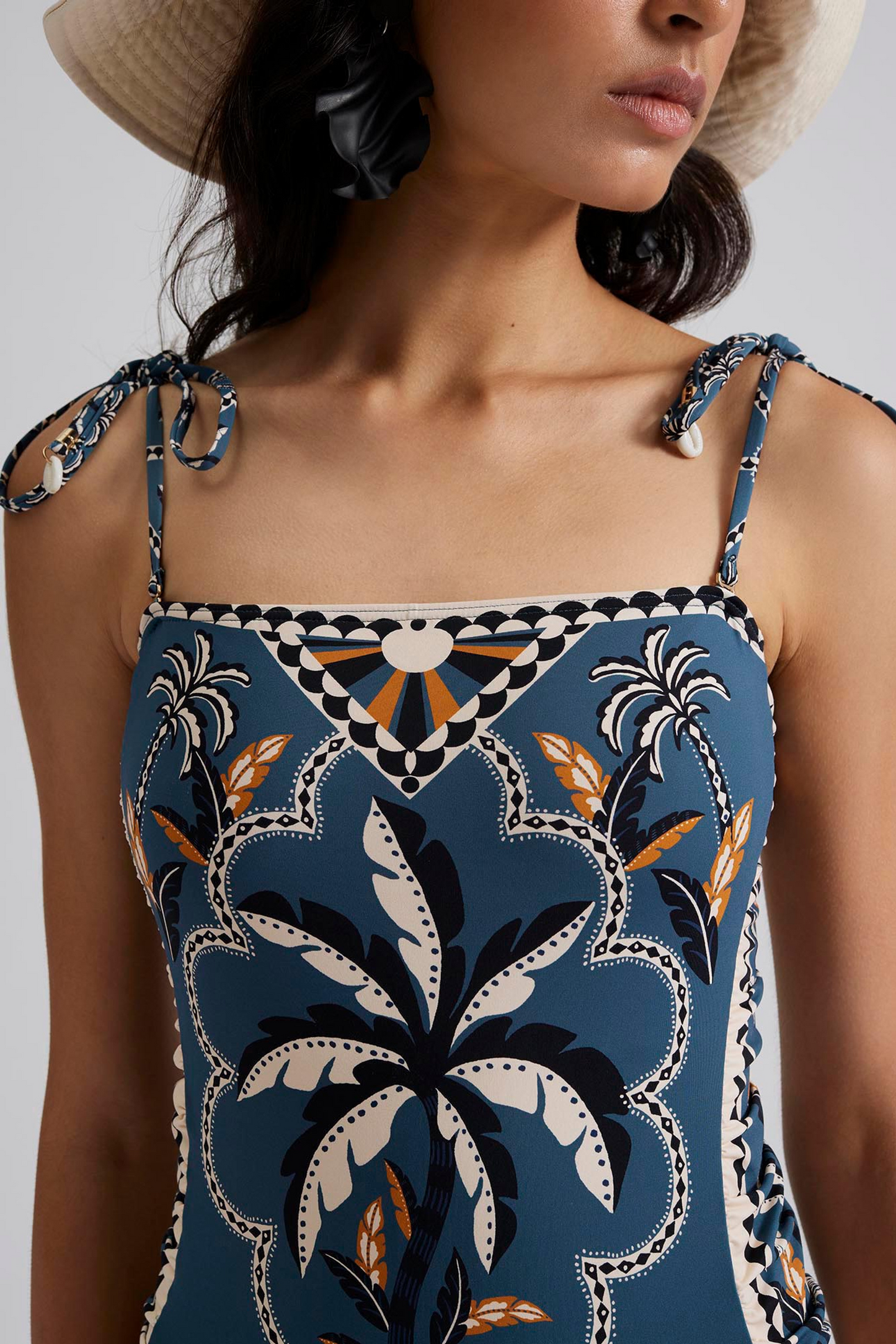 Front close up Malina Printed swimsuit with fern tie shoulder. The perfection addition to your luxury designer resort wear wardrobe. 