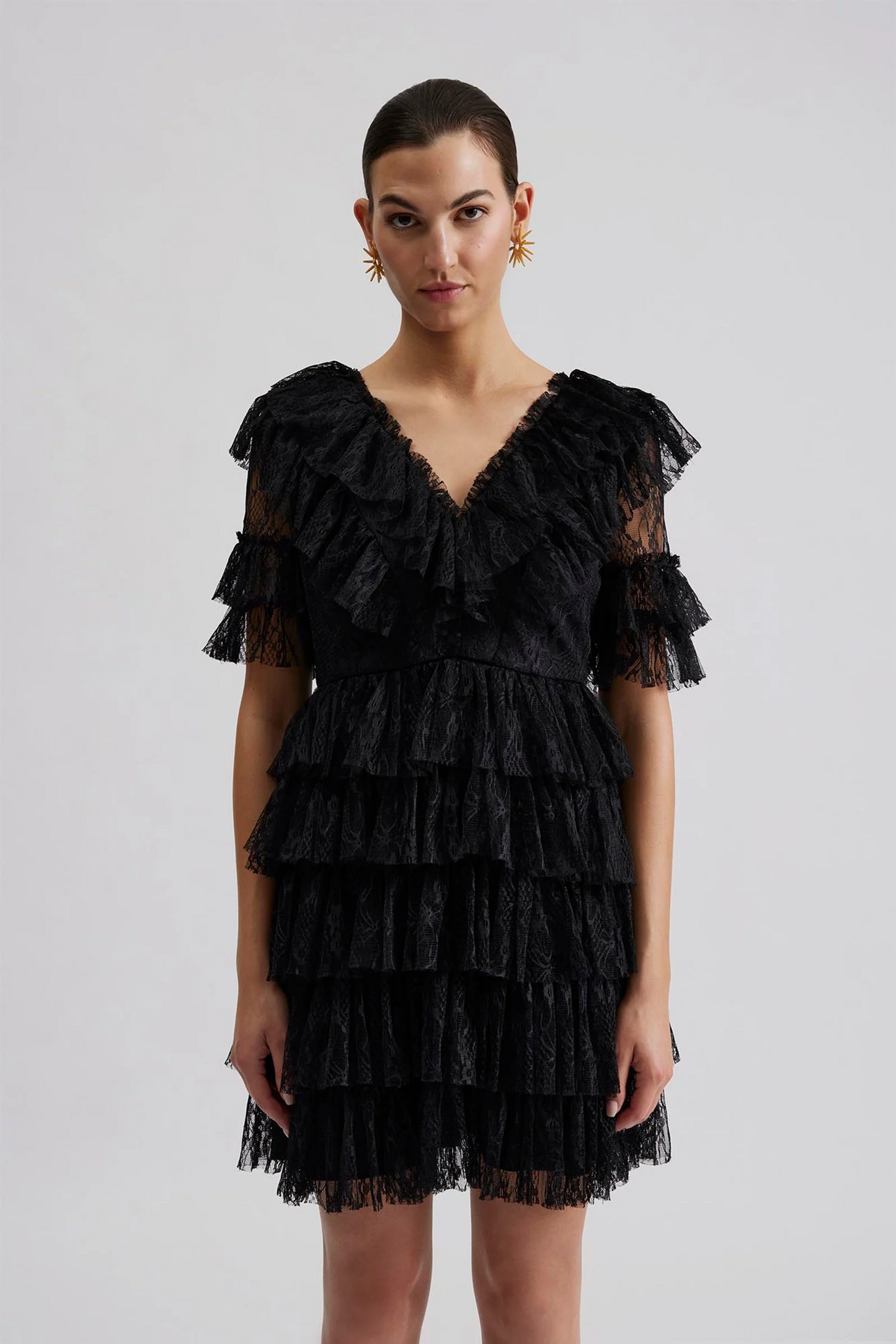 Front facing 2 Malina Ready-to-Wear short sleeved lace dress with frill details and v-neck. The perfect addition to your luxury designer resort wear wardrobe.  