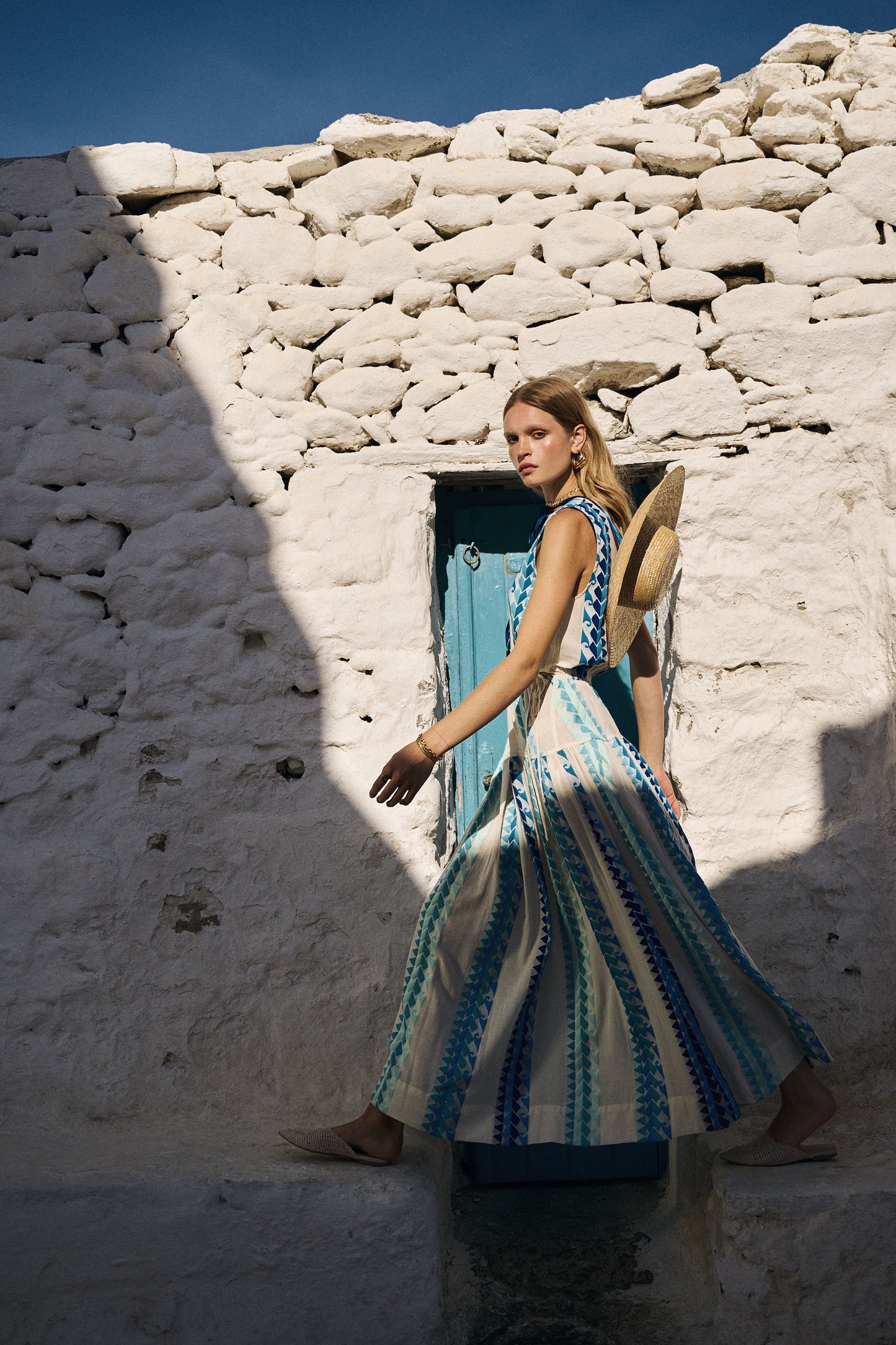 Side facing Nema Neira Jacquard Blue Maxi Dress. The perfect addition to your luxury designer resort wear wardrobe.  