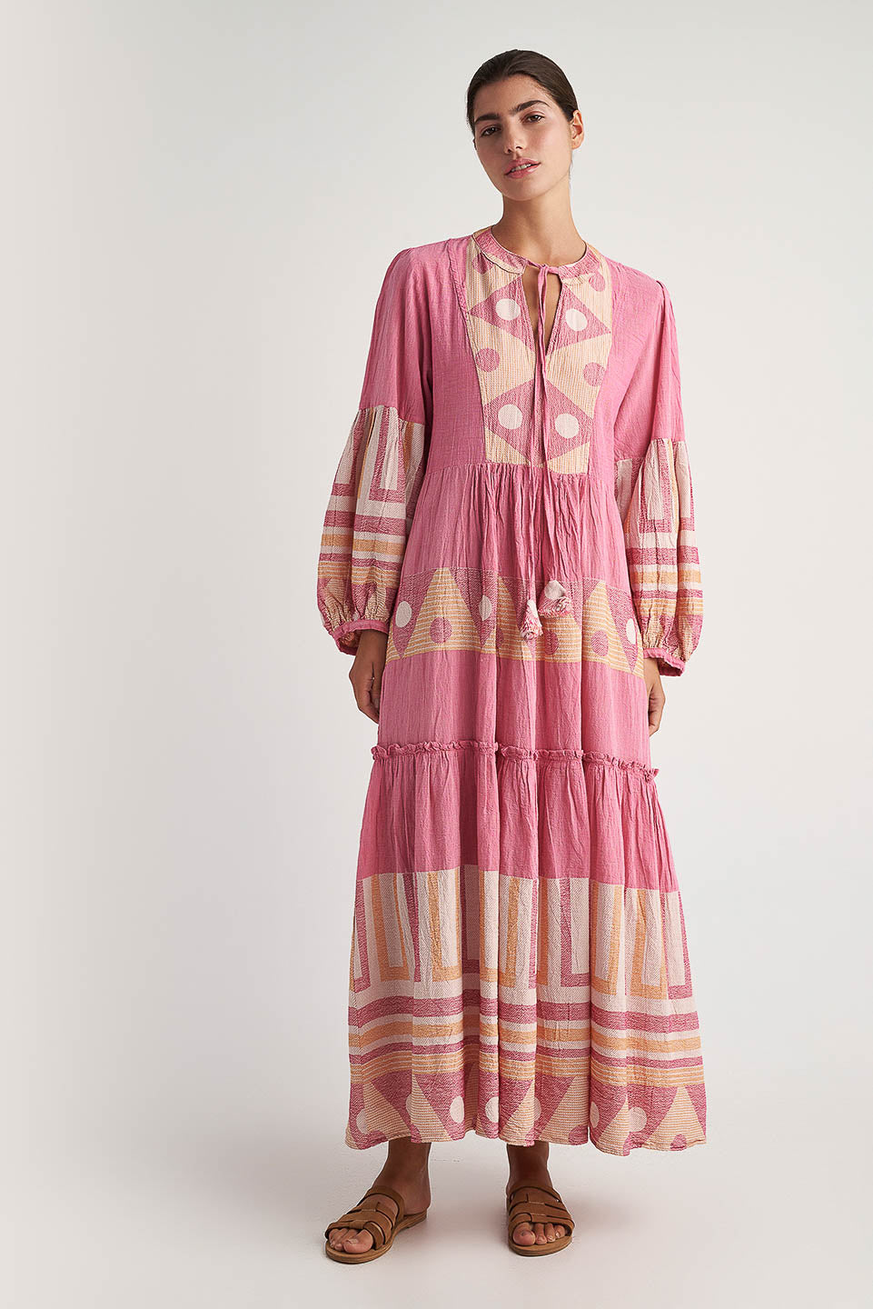 Front facing Pearl & Caviar long sleeve pink maxi dress with gathered cuffs and side pockets. The perfect addition to your luxury designer resort wear wardrobe.  