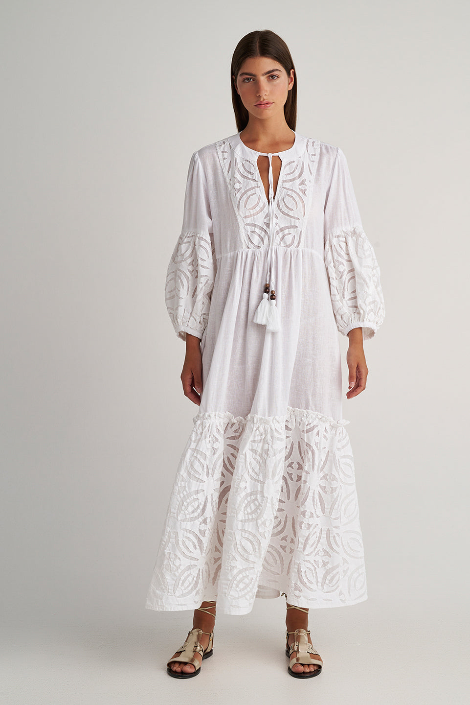 Front facing Pearl & Caviar Long sleeve pure white maxi dress with layered cut-out detailing. The perfect addition to your luxury designer resort wear wardrobe.  