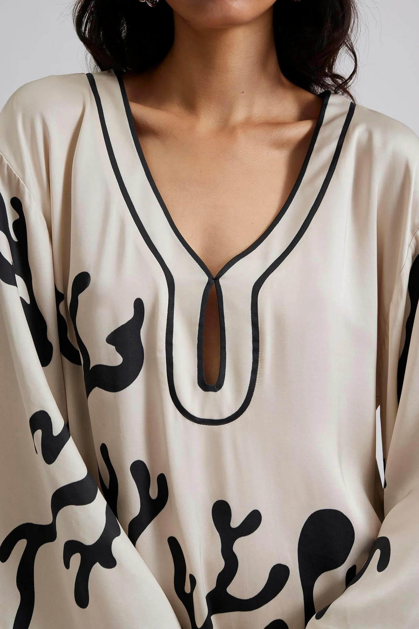 Close up Malina Printed satin kaftan dress with wide sleeve and cut-out details. The perfect addition to your luxury designer resort wear wardrobe.  