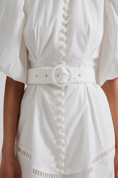 Close up Pouf sleeve mini dress with embroidered details, belt in the waist and crochet covered buttons